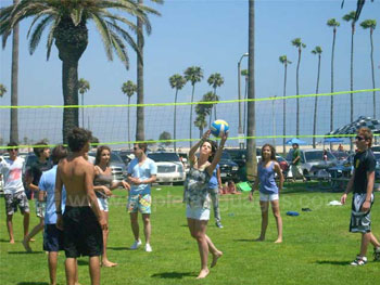 Playing volleyball with classmates